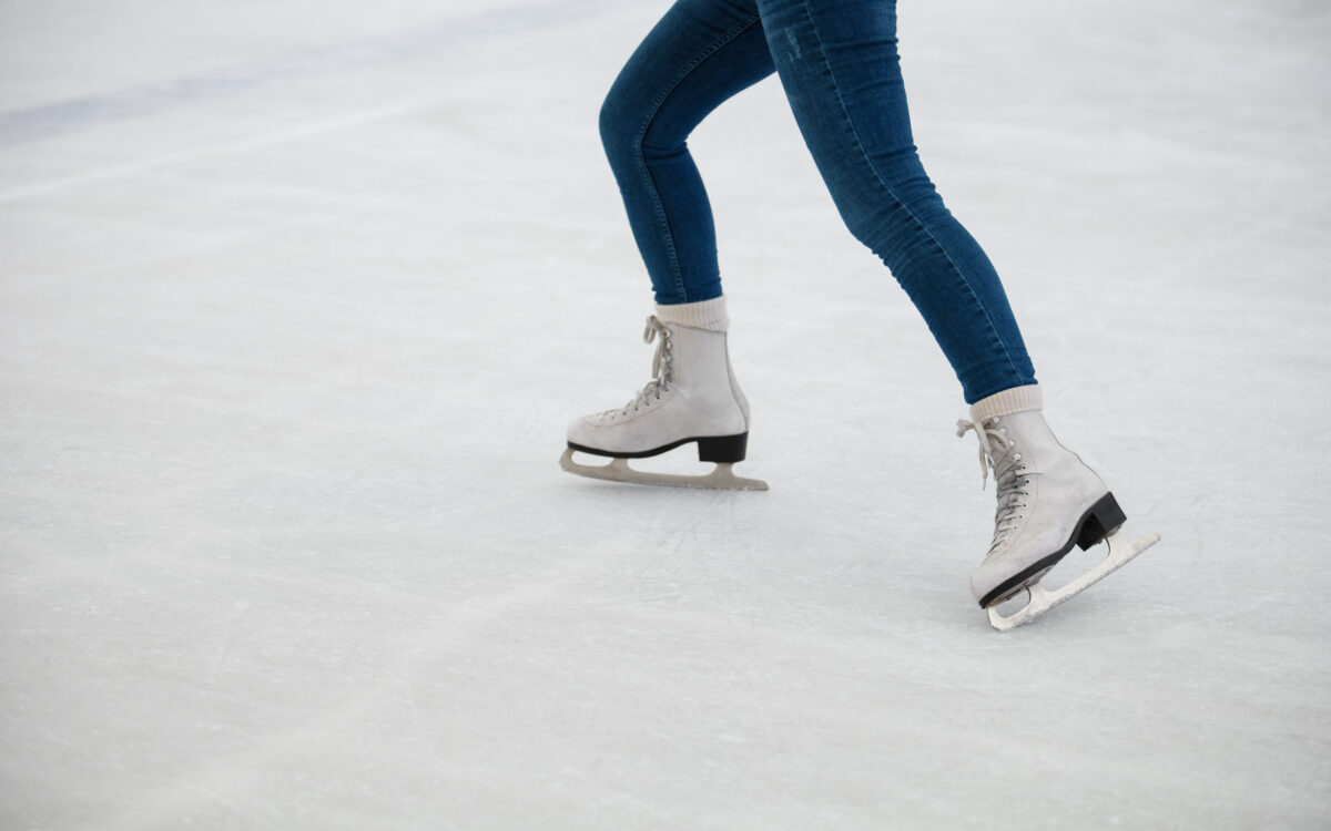 Side view woman ice skating
